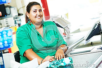 Shopping. Cashdesk cashier worker in supermarket Stock Photo