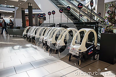 Shopping centre showing childs police buggy Editorial Stock Photo