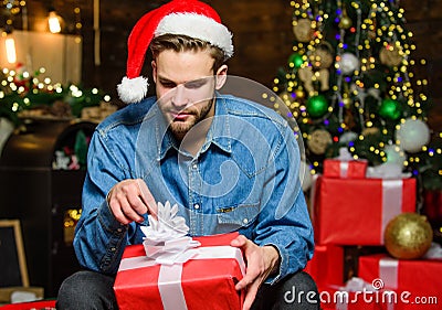 Shopping concept. How to Choose Perfect Gift. Man Santa claus with gift box. Handsome guy celebrate christmas. Perfect Stock Photo