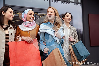 Shopping. Diversity Women Bonding Bags. Smiling Multicultural Girls Walking Near Mall. Stock Photo