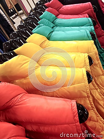 Shopping for her - multicolored coats for winter Stock Photo