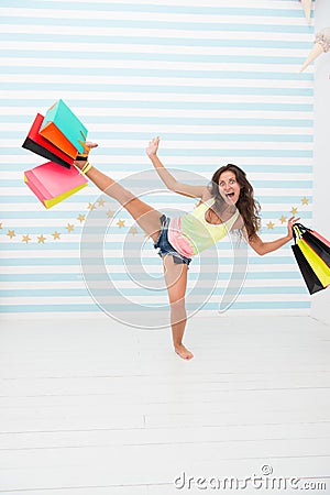 Shopping hunter girl with purchase after big sale. happy and excited woman with shopping bags. black friday sale in shop Stock Photo