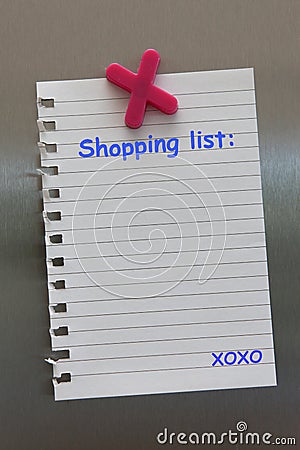 Shopping list note on a fridge door with magnet Stock Photo