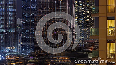 Shopping mall exterior with reastaurants on balconies night timelapse in Dubai, United Arab Emirates Editorial Stock Photo