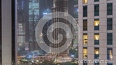 Shopping mall exterior with reastaurants on balconies night timelapse in Dubai, United Arab Emirates Editorial Stock Photo