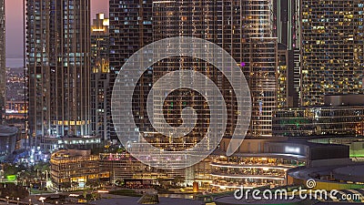 Shopping mall exterior with reastaurants day to night timelapse in Dubai, United Arab Emirates Editorial Stock Photo