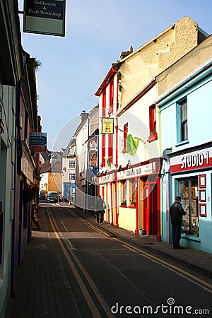 Shopping in a narrow street in Kinsale, County Cork, Ireland on the 18th March. Small shops in a small town Editorial Stock Photo