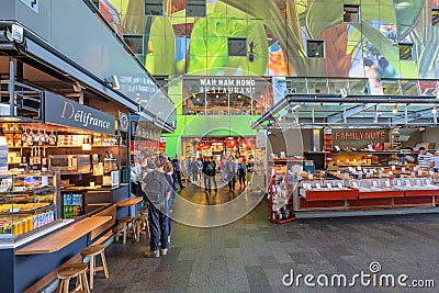Shopping people inside the beautiful artistic and colorful market hall of Rotterdam, the Netherlands. Editorial Stock Photo