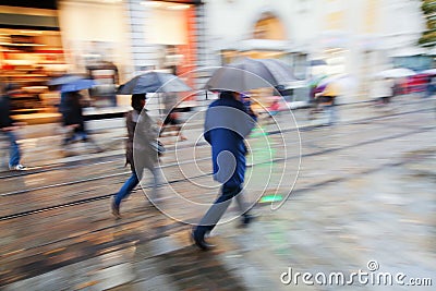 Shopping people in the rainy city Stock Photo