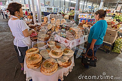 Kazakh women shopping in the Samal Bazaar in Shymkent, Kazakhstan. Editorial Stock Photo