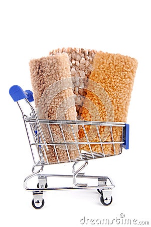 Shopping trolley with carpet isoalted Stock Photo