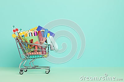 Shopping trolley full of school supplies. Preparation to school, shopping, sale, deals, discounts, promotion Stock Photo