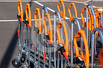 Shopping trolleys lined up at hardware store. Close up Stock Photo