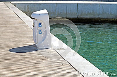 Shore Based Electricity Supply Appliance With Lantern On Top For Boats Power And Battery Charged . Stock Photo