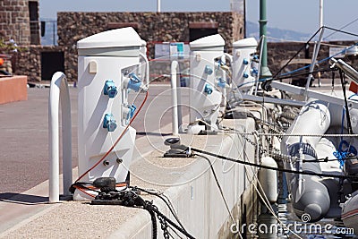 Shore Based Electricity Supply Appliance Power Supply And Battery Charged on the dock Stock Photo