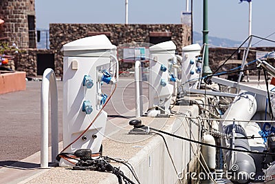 Shore Based Electricity Supply Appliance Power Supply And Battery Charged on the dock Stock Photo