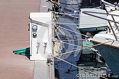 Shore Based Electricity Supply Appliance Power Supply And Battery Charged on the dock Stock Photo