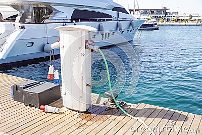 Shore Based Electricity Supply Appliance Power Supply And Battery Charged on the dock . Stock Photo