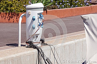 Shore Based Electricity Supply Appliance Power Supply And Battery Charged on the dock Stock Photo