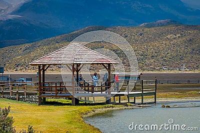 Shore of the lake Limpiopungo located in Cotopaxi national park, Ecuador in a sunny and windy day Editorial Stock Photo