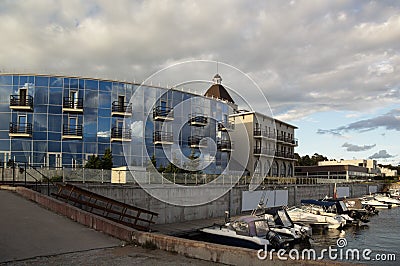 On the shore of the sea bay there were yachts on the quay Stock Photo