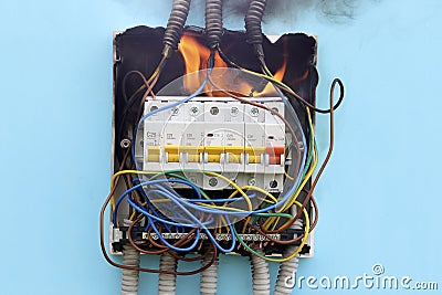 Electrical fire resulting from short circuit in faulty electrical wiring. Stock Photo