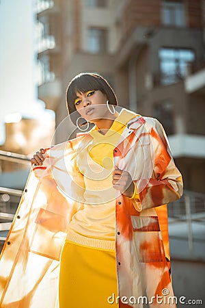 Short-haired extraordinary woman under covering her robe Stock Photo