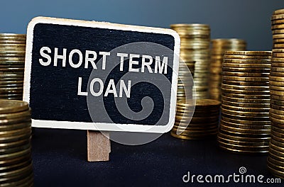 Short term loan inscription and stack of coins Stock Photo