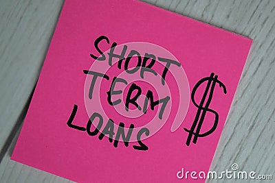 Short Term Loans write on sticky notes isolated on office desk Stock Photo