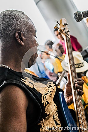 Panama City, Panama, August 15, 2015. Close-up of African-American musician playing guitar with his group Editorial Stock Photo