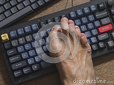 Mechanical gaming keyboard with modify tools with foot cracking Stock Photo