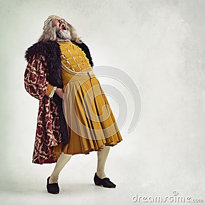 HAHAHAHAHAHA. Shot of a bearded king laughing hysterically. Stock Photo