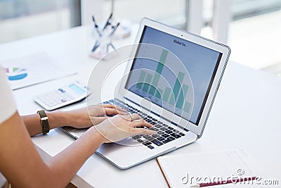 Taking the day to attend to my finances. Shot of a businesswoman using her laptop to compile spreadsheets. Stock Photo