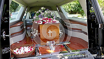 Shot of a colorful casket in a hearse or chapel before funeral or burial at cemetery Stock Photo