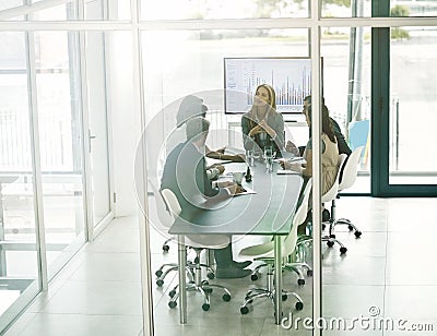 Presenting ideas to the team. Shot of corporate businesspeople meeting in the boardroom. Stock Photo