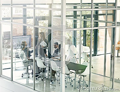 Presenting ideas to the team. Shot of corporate businesspeople meeting in the boardroom. Stock Photo