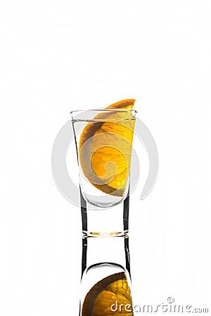 Shot glass with orange slice Stock Photo
