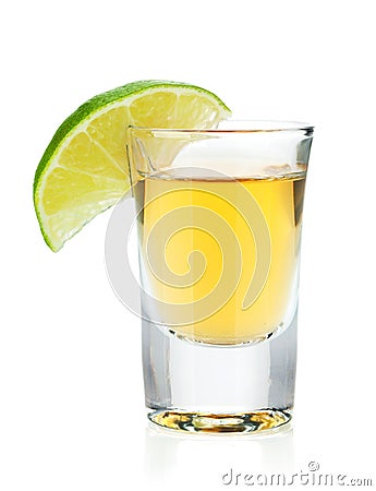 Shot of gold tequila with lime slice Stock Photo