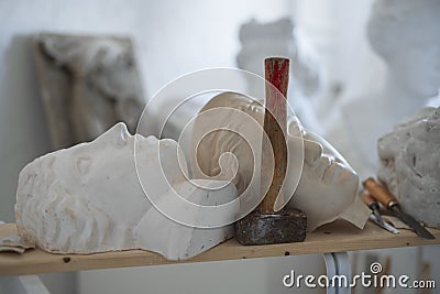 Workshop of sculptor with marble heads of greek people Stock Photo