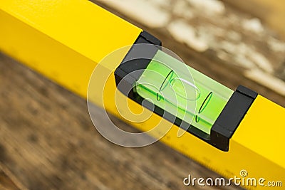 Shot of a level tool , yellow block level with bubble clipping path included. Stock Photo