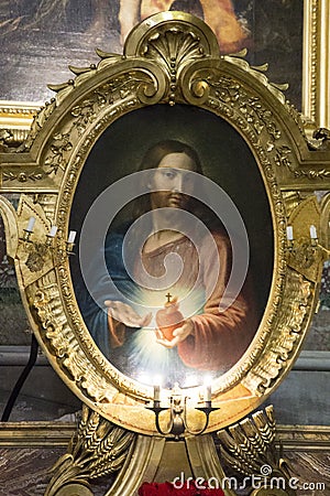 Shot of the most famous image of the Sacred Heart of Jesus in a golden frame Editorial Stock Photo