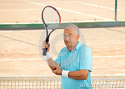 Injured tennis sportsman Stock Photo