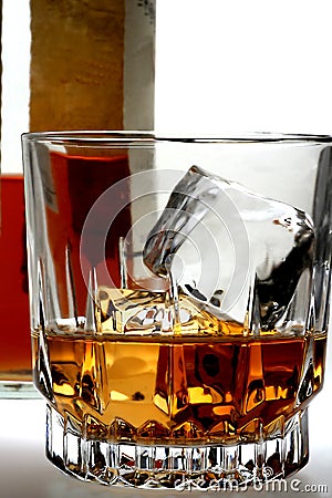 Shot of Whiskey and Bottle Stock Photo