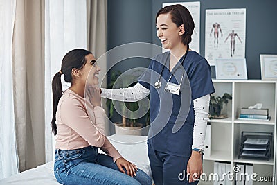 Everythings going to be okay. Shot of a young female doctor comforting a patient in an office. Stock Photo