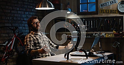 Young man talking on camera in a workshop Stock Photo