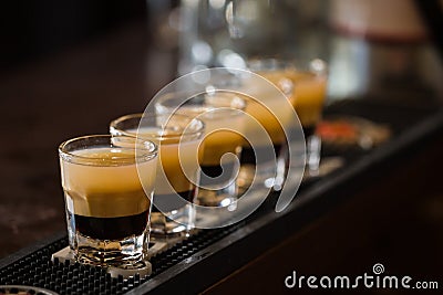 Shots with rum and liquor in cocktail club Stock Photo