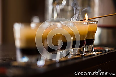 Shots with rum and liquor in cocktail club Stock Photo