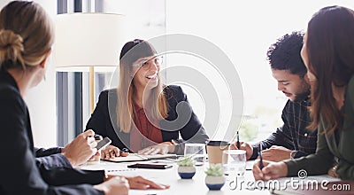 We should absolutely use your idea in our master plan. a group of businesspeople having a meeting in a boardroom. Stock Photo