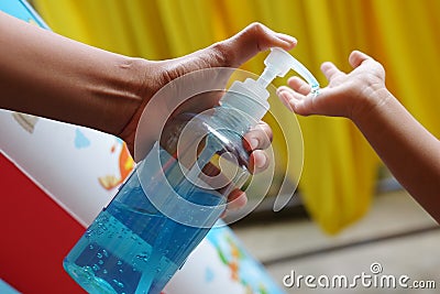 Should use an alcohol-based hand spray children at home regularly.COVID-19. Stock Photo