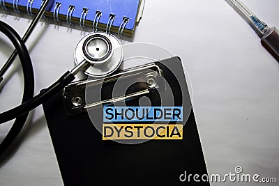 Shoulder Dystocia text on top view isolated on white background. Healthcare/Medical concept Stock Photo